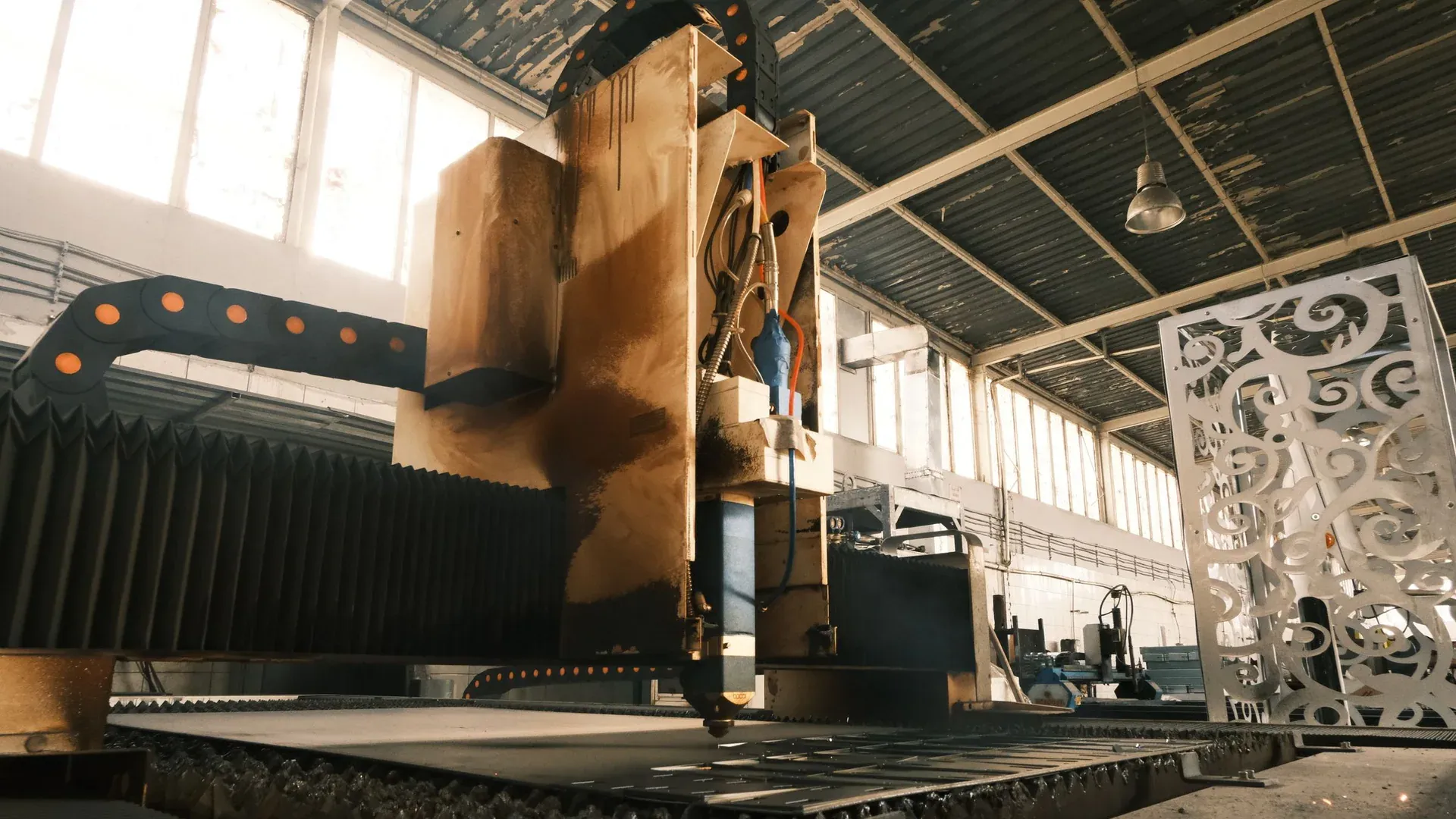Close-up of a laser cutter in an industrial factory, showcasing modern manufacturing technology