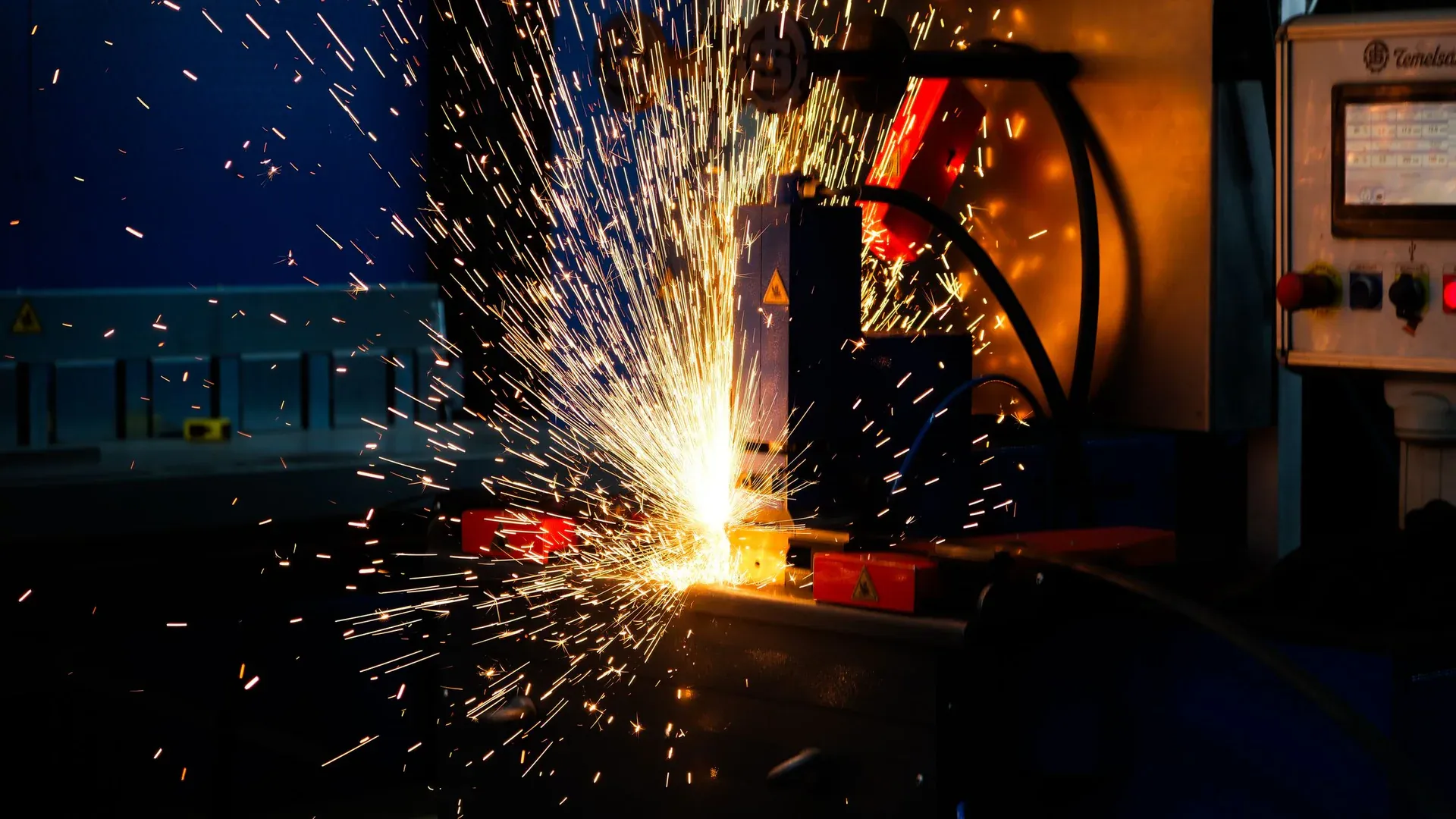 Vibrant display of welding sparks in an industrial setting, highlighting manufacturing processes