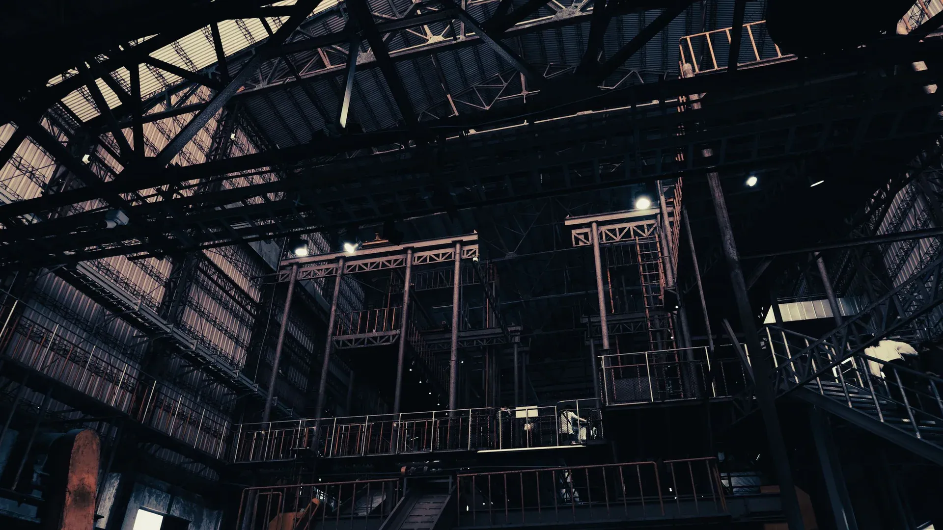 Low angle view of a dimly lit factory interior, showcasing industrial architecture in Pingtung, Taiwan