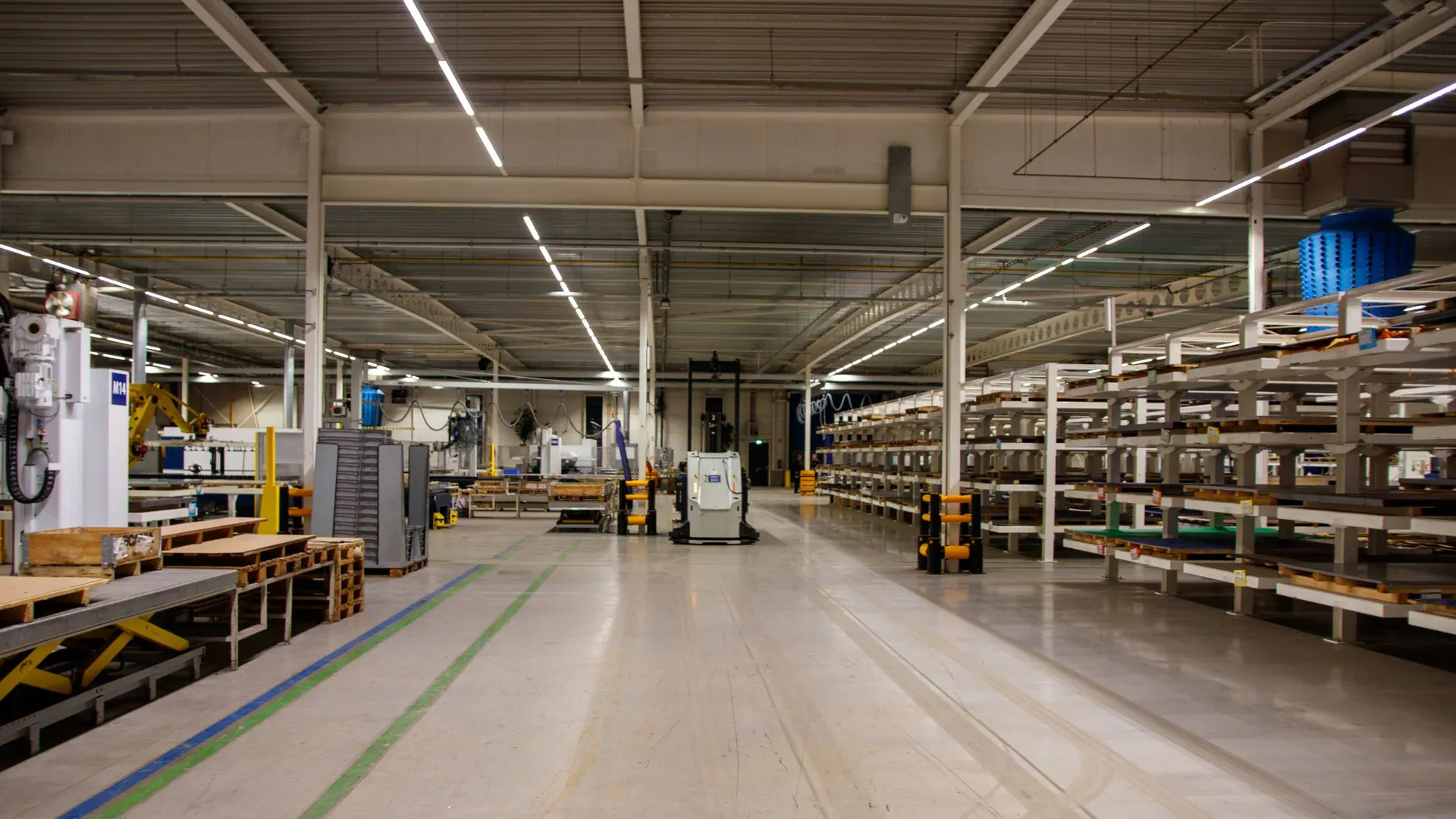 Industrial machinery arranged inside a production workshop