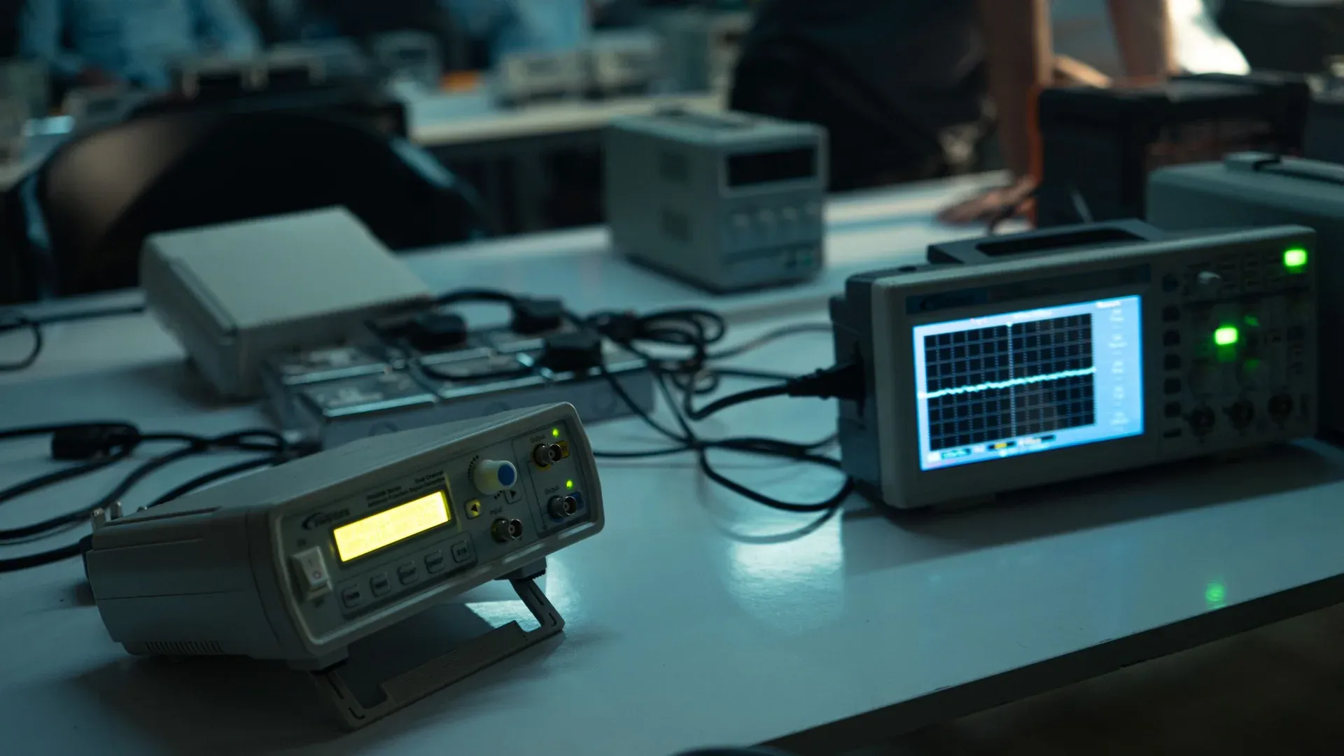 Electronic test instruments arranged on a laboratory workbench