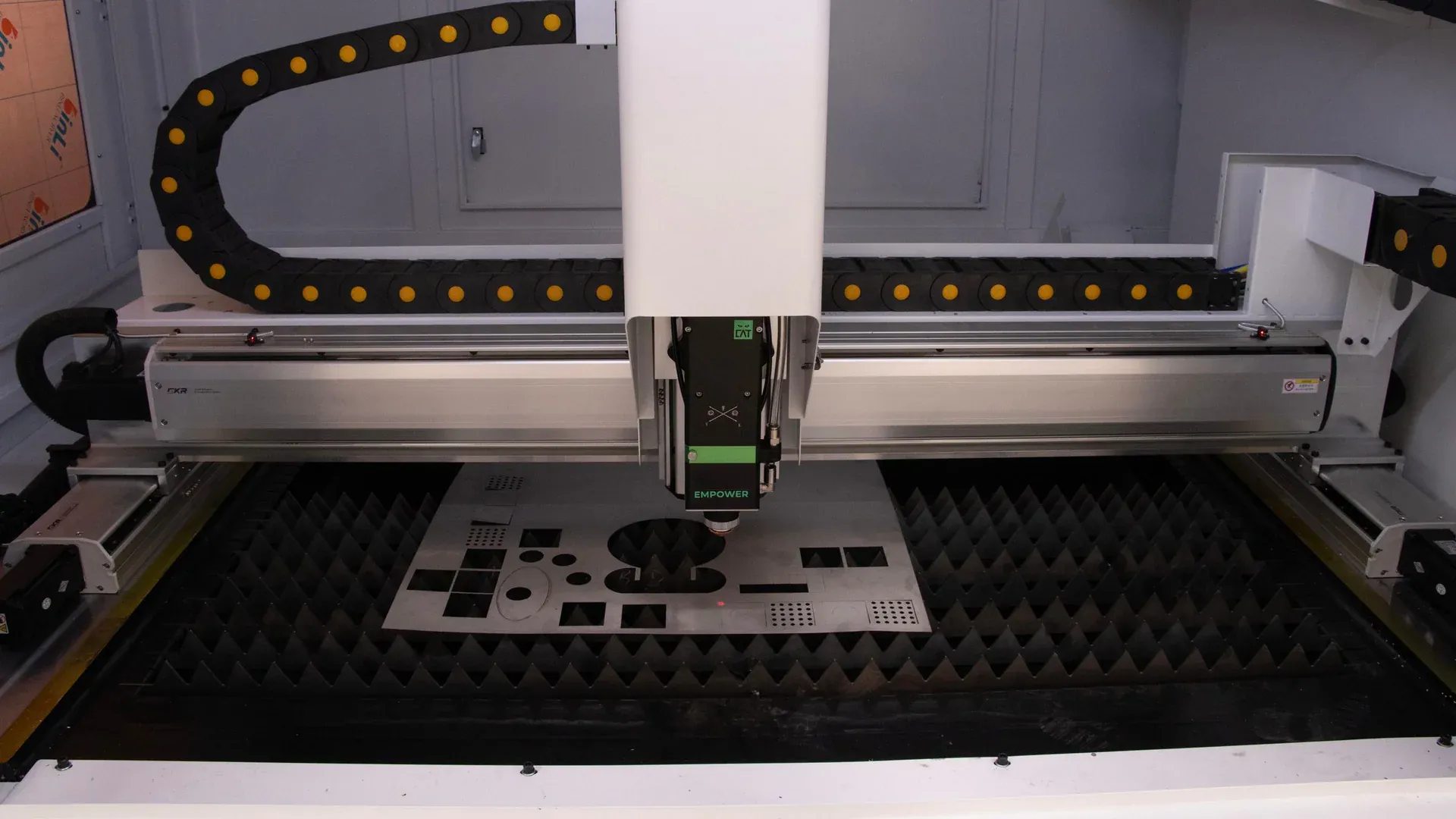 CNC laser cutting cell representing in-house metal fabrication capacity