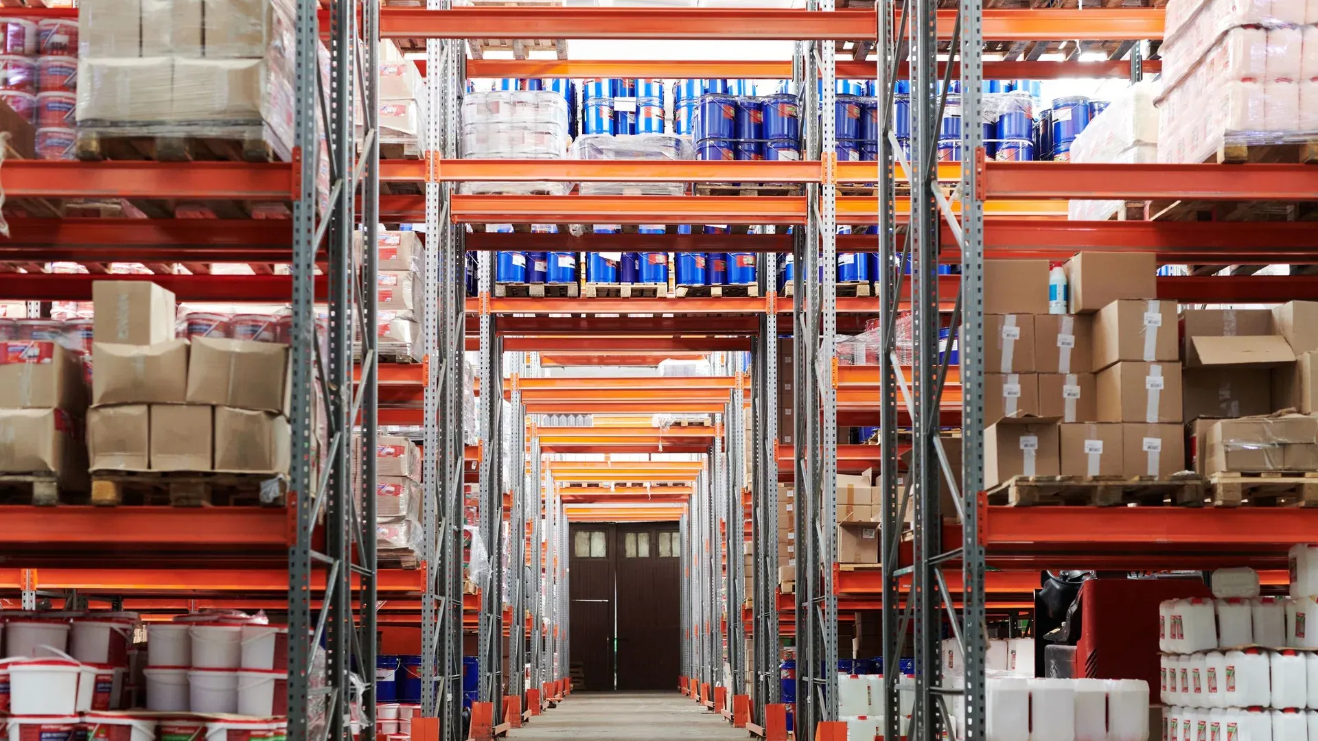 Warehouse shelves organized for controlled industrial spare-parts inventory