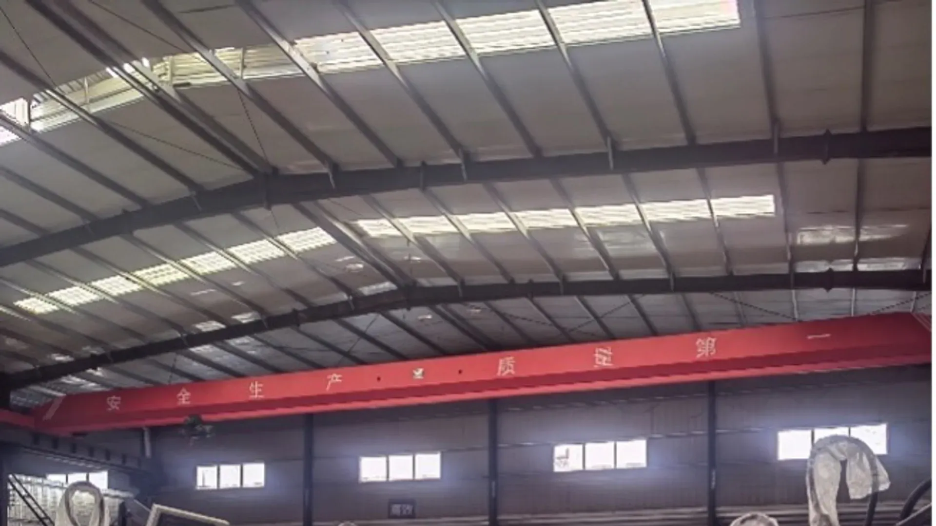 Busbar processing machines positioned on an industrial factory floor