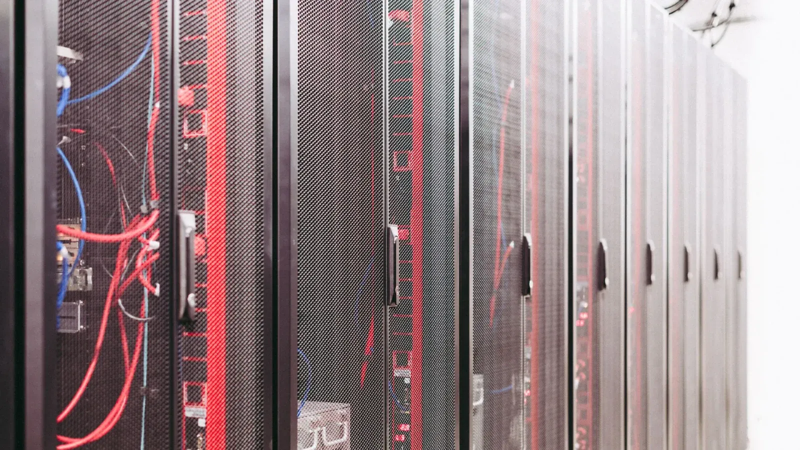 High-density server rack cabinets with overhead cable and busway power distribution in an AI data center