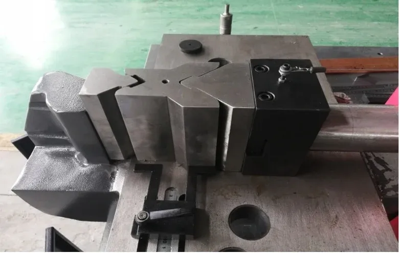 Open busbar bending tooling and locating surfaces on a workstation