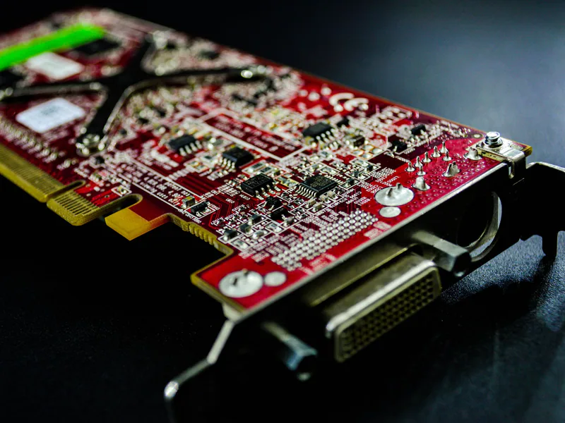 Detailed close-up of a red circuit board highlighting electronic components and connectors