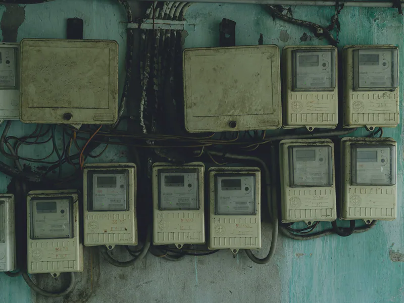 Aged and rusty electrical panels on an outdoor wall in Ho Chi Minh City, Vietnam