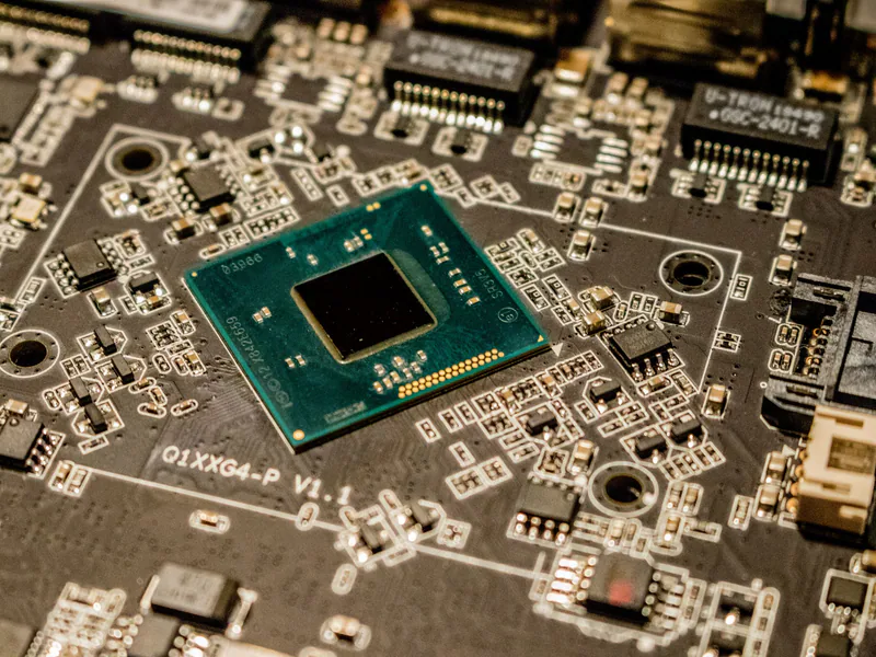 Detailed view of a microchip on a printed circuit board, showcasing electronic components