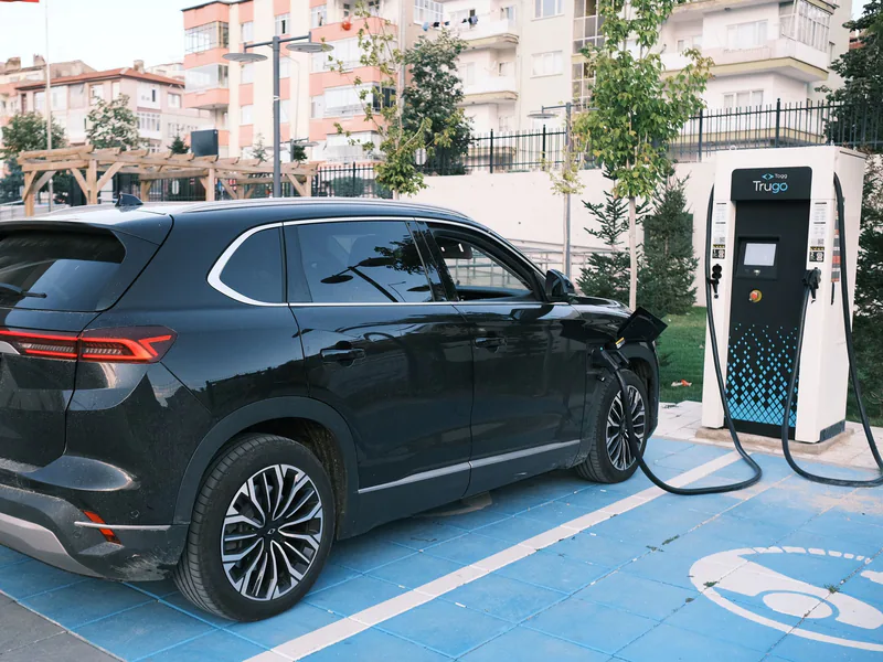 Electric car charging at a station in Niğde, Türkiye, highlighting clean energy