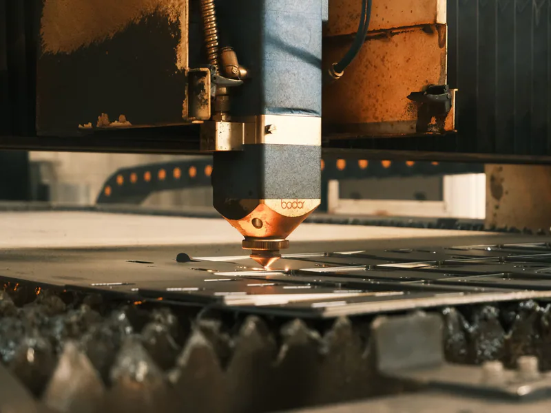 Close-up of a laser cutter operating in an industrial setting in Ankara, Türkiye