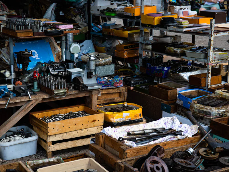 A detailed view of a workshop showcasing a variety of tools and equipment for crafting and repairs