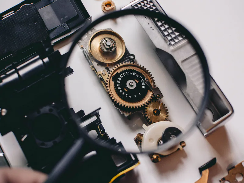 Intricate gears of a camera mechanism magnified, showcasing mechanical precision