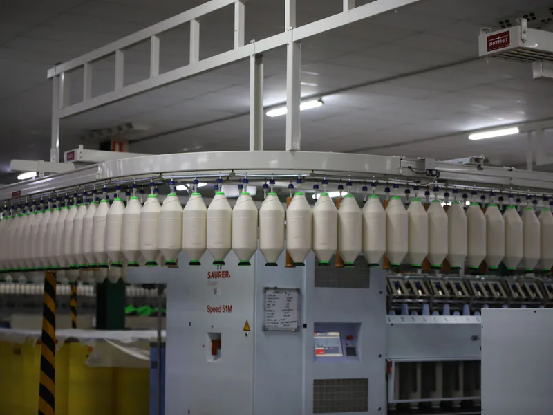 Industrial textile factory with yarn production line showcasing automated machinery for efficient manufacturing