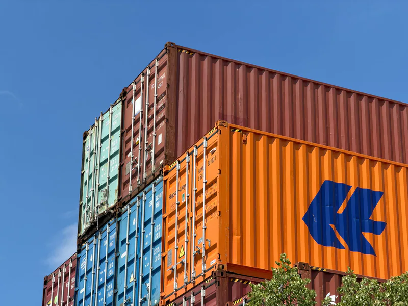 Colorful shipping containers stacked in an outdoor storage area in Germany