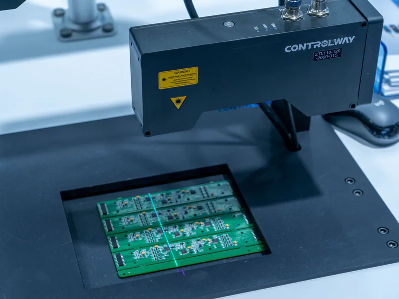 Close-up of a PCB inspection machine in action, highlighting technology