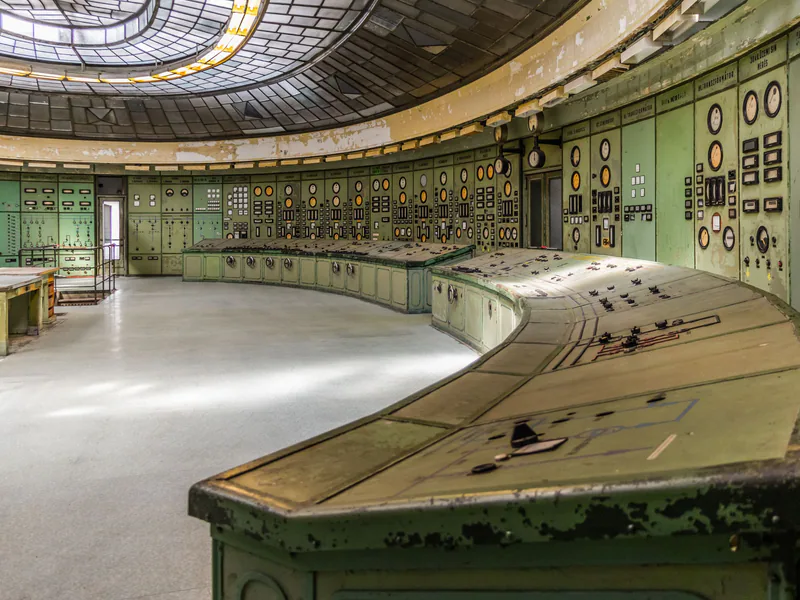 Retro industrial control room with vintage panels and dials in an old power plant