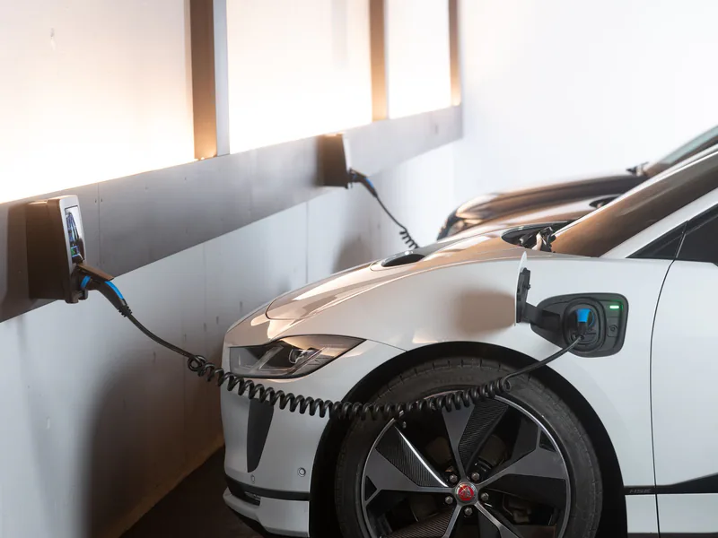 Electric car charging in a modern indoor station promoting sustainability and energy efficiency