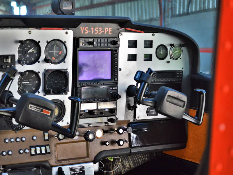 Close-up of a vintage aircraft cockpit showing detailed control panels and instruments