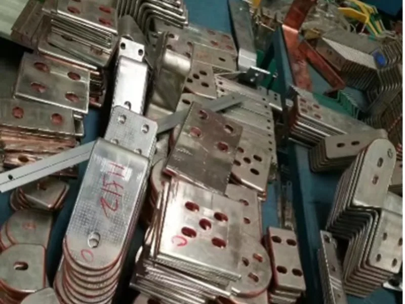 Punched copper busbar samples with repeated hole patterns