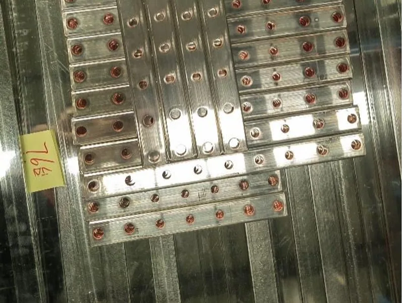 Finished metal busbar parts grouped by production lot