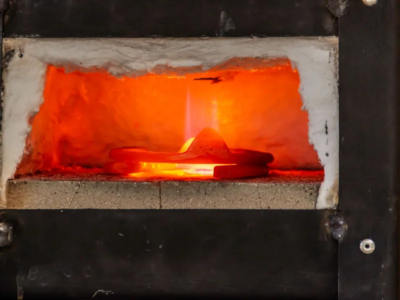 Glowing furnace opening during an industrial heat-treatment cycle