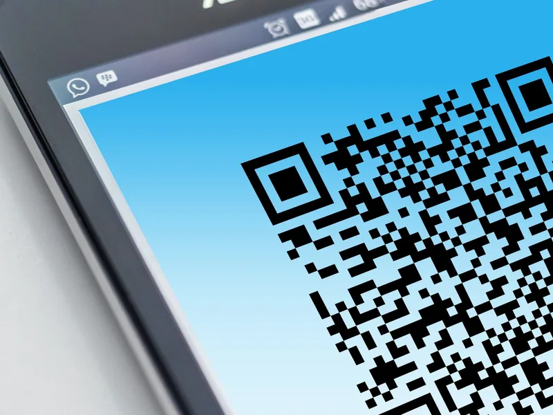 Smartphone displaying a machine-readable QR code