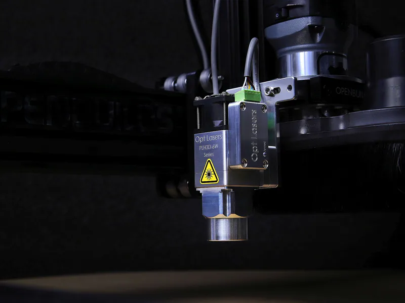 Industrial laser marking head inside an enclosed machine
