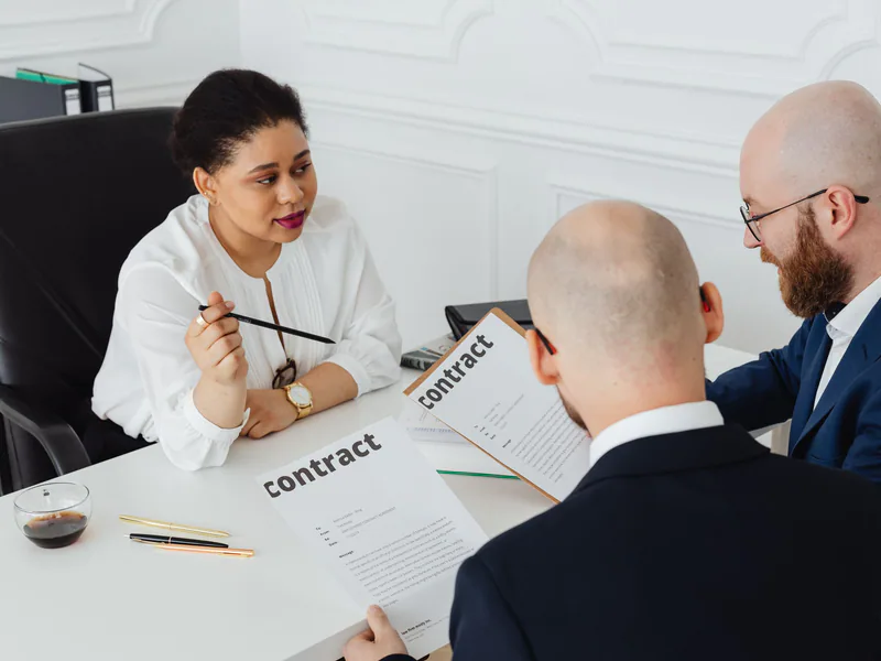 Procurement team reviewing an industrial equipment contract