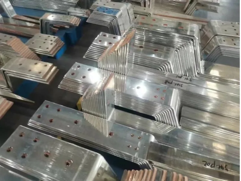 Formed copper busbar samples grouped for a representative part-family review