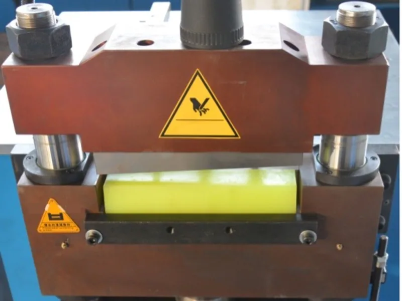 A hydraulic busbar shearing unit with guarded cutting area
